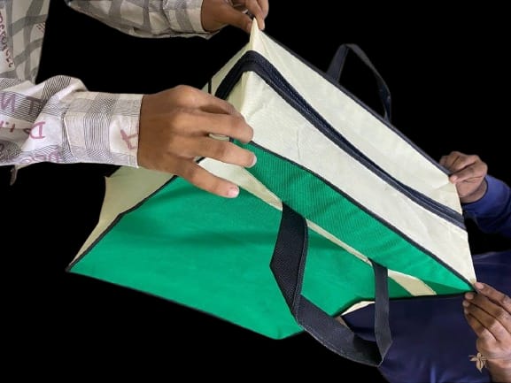 Custom tote bags being finished at the Pak Green Packaging facility